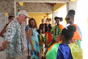 Young members of a traditional clown dance group on Nevis entertain members of Globe to Globe from London, as they arrived at the Nevis Performing Arts Centre on September 03, 2014 for their performance of William Shakespeare’s play Hamlet